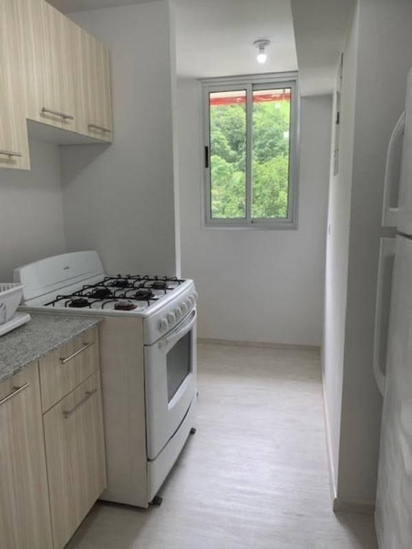 Light wood built-in wardrobe with sliding doors PH Bella Natura Apartment Panama