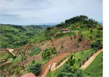 Rustic mountain cabins overlooking lush valley and forest Las Minas Herrera Panama