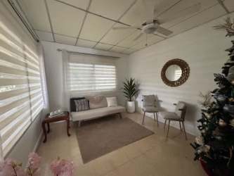 Bedroom with large bed, windows, tile flooring in property for sale in Chitré Herrera Panama