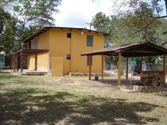 Rustic outdoor BBQ with stone grill covered patio Brisas del Coronado Panama
