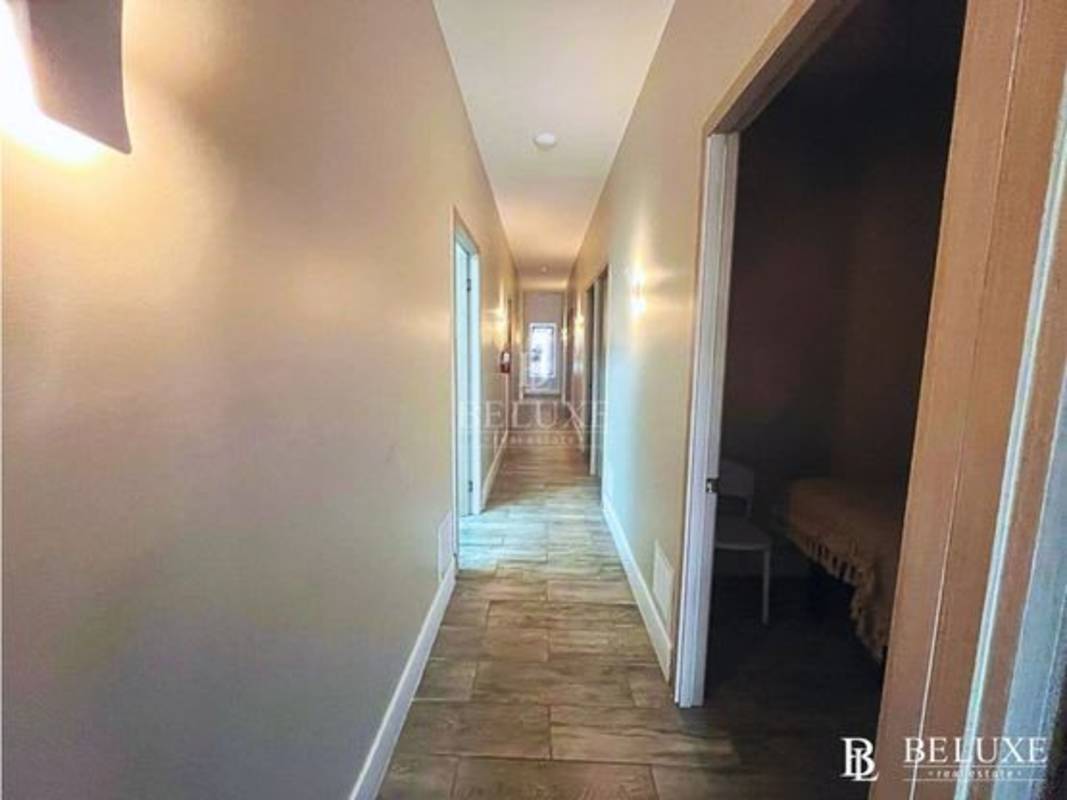 Commercial interior corridor with neutral walls and granite tiles in San Francisco Panama