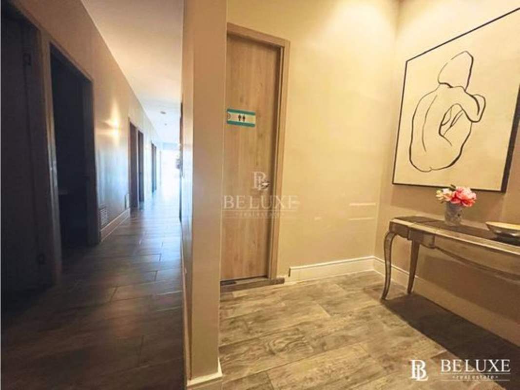 Wide hallway with light walls and modern design in commercial rental San Francisco Panama