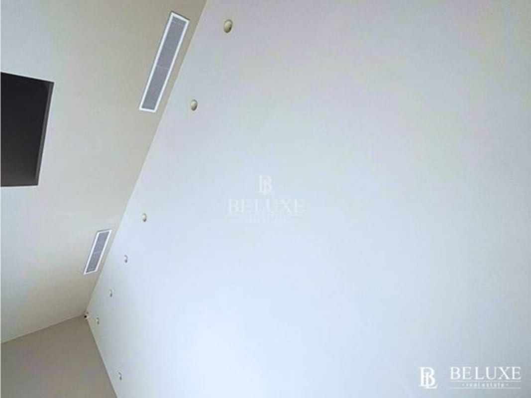 Accessible hallway with wood doors and beige walls in commercial plaza San Francisco Panama