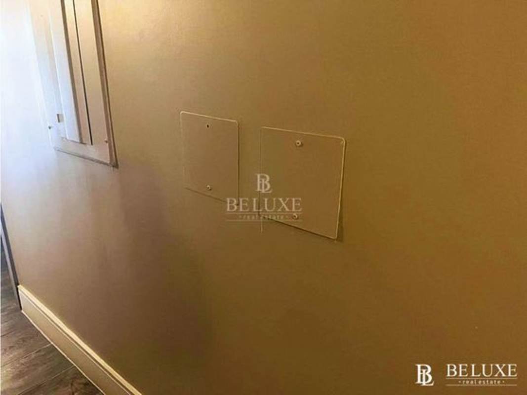 Interior hallway with beige walls and electrical panels commercial rental San Francisco Panama