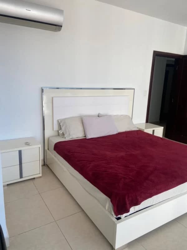 Modern oceanfront balcony with glass railing, outdoor seating, panoramic views Punta Paitilla Panama