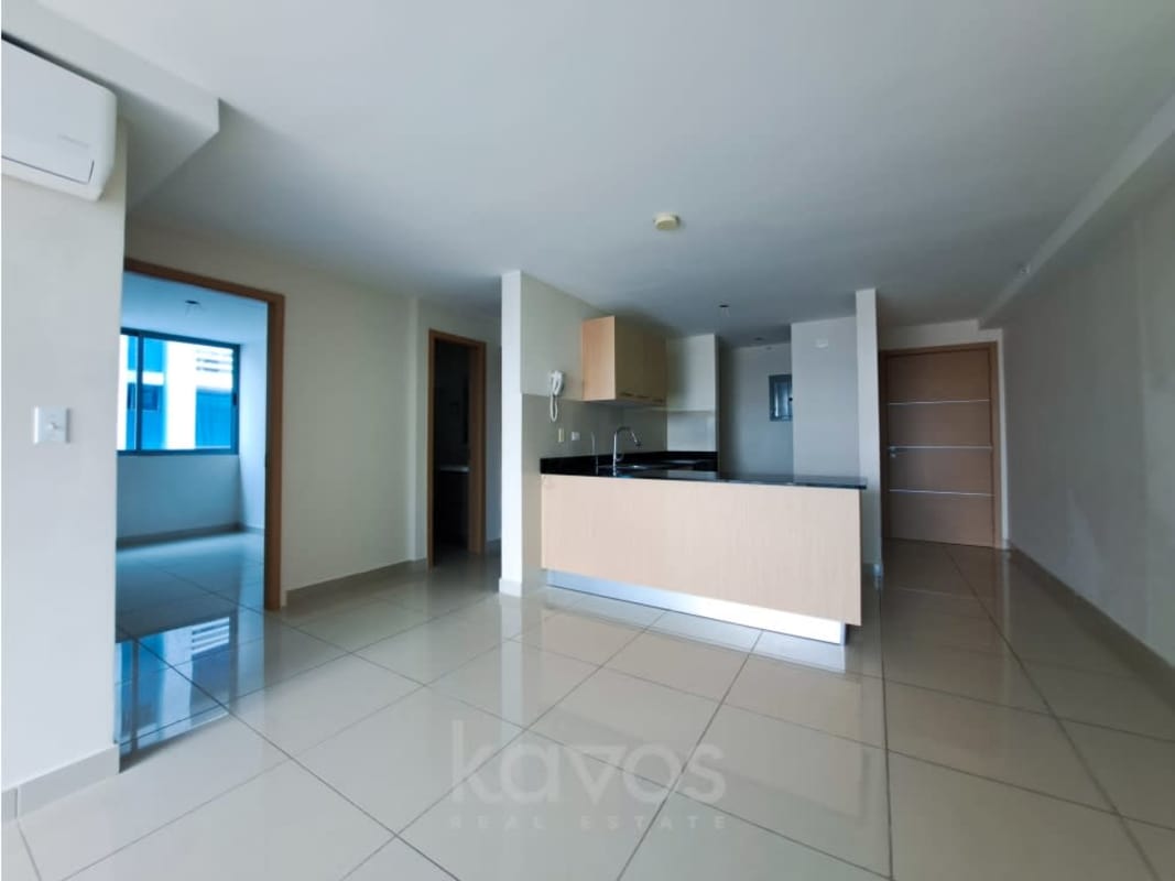Modern open living room with kitchen and large window PH Torres de Castilla Panama