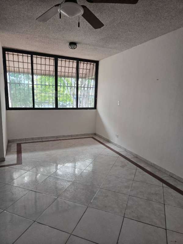 Kitchen cabinetry with laundry area and decorative tiles in PH La Alameda Panama