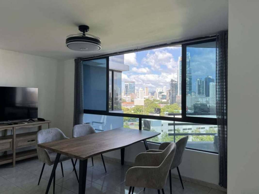Dining area with floor-to-ceiling window city skyline PH Miraluz Panama