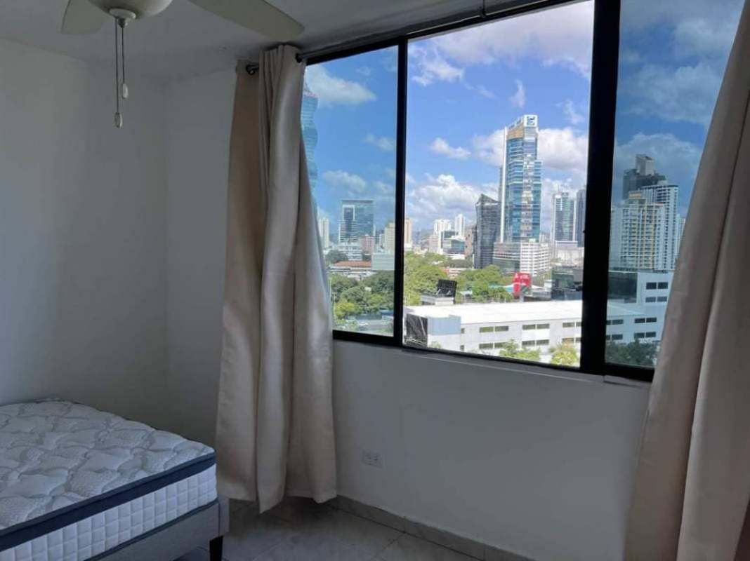 Bedroom with floor to ceiling windows with city skyline Punta Pacifica Panama