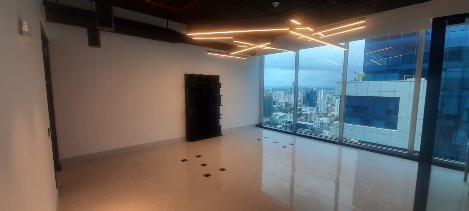 Furnished office with glass windows showcasing ocean and skyline views in PH Oceania Punta Pacifica Panama