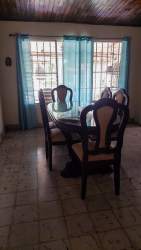 Traditional dining room with wood panel ceiling ceramic floors ample lighting David Chiriqui Panama