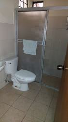 Bathroom featuring glass shower enclosure ceramic tile modern fixtures Chiriqui Panama