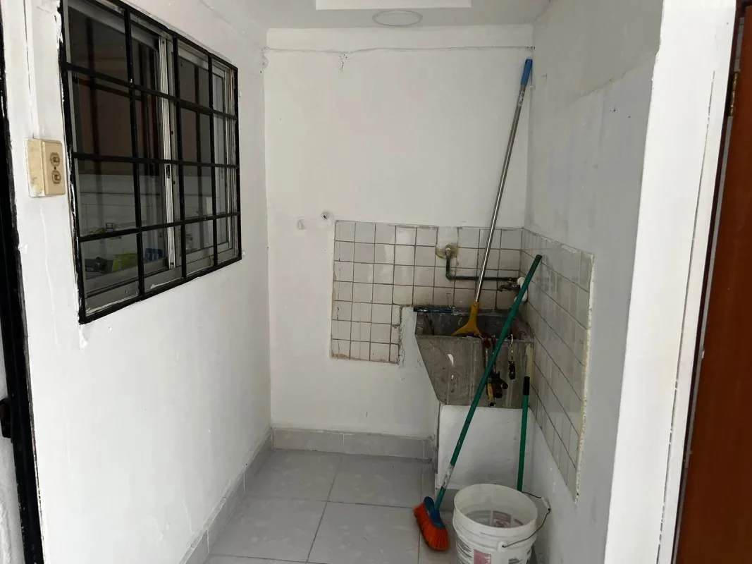 Spacious living and dining room with ceiling fan and large windows La Loceria Panama