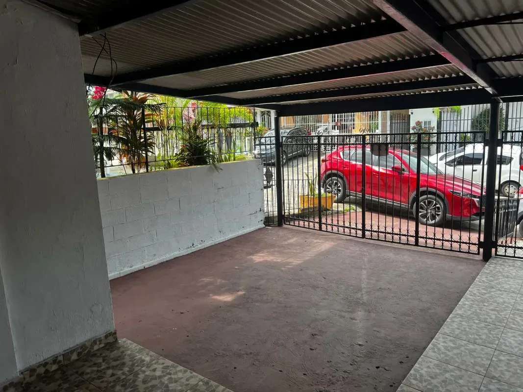 Basic laundry area with utility sink, bars window, cleaning supplies La Loceria Panama