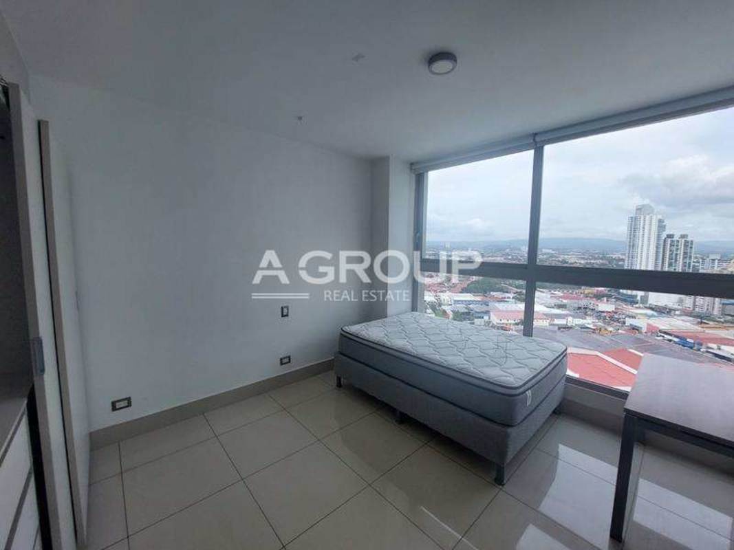 Bedroom with floor-to-ceiling windows and ocean skyline view PH Bali Costa del Este