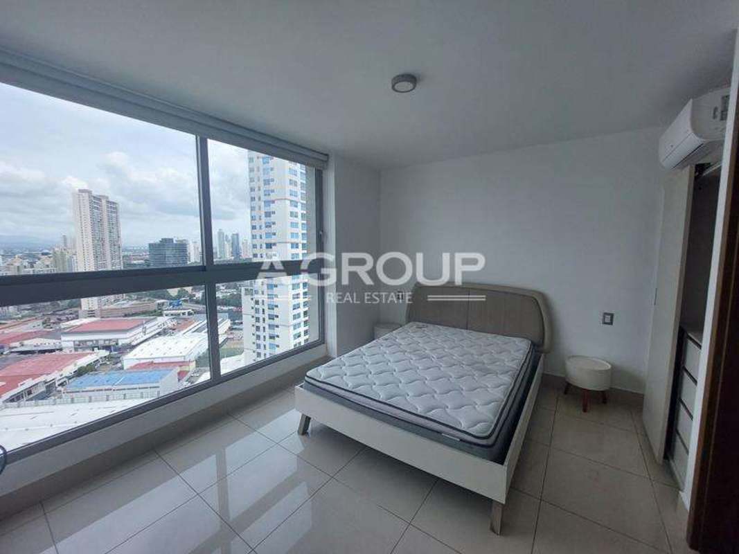 Bright bedroom with panoramic skyline window PH Bali Costa del Este