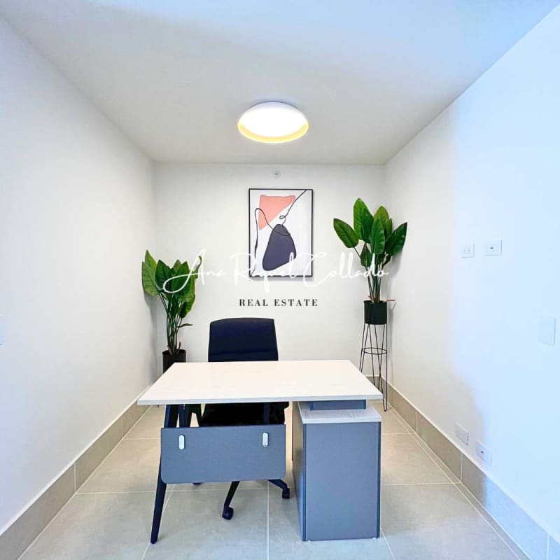 Spacious bedroom with window, TV, upholstered bed in PH Ocean House Santa Maria