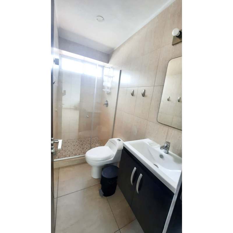 Modern tiled bathroom with walk-in shower at PH Vista Park Towers San Francisco Panama