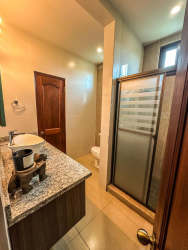 Contemporary bathroom with glass shower enclosure in Boquete Los Molinos Panama