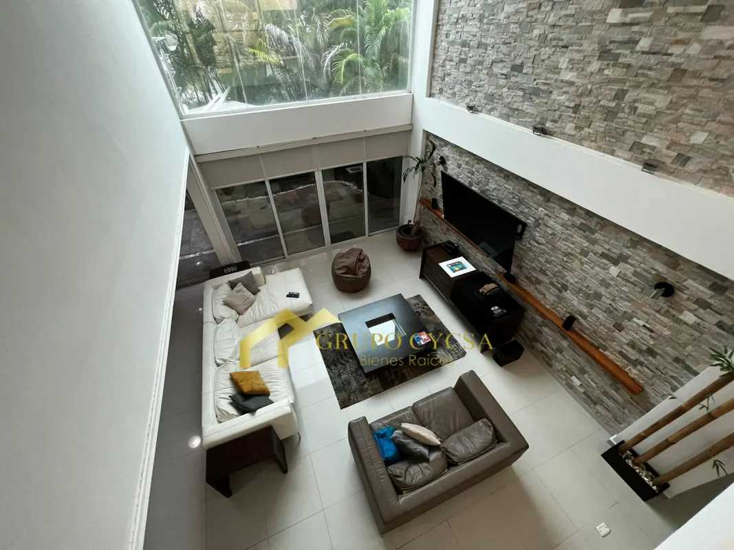 Modern kitchen with island, coralina accent wall, stainless appliances in PH Costa Esmeralda Costa Sur