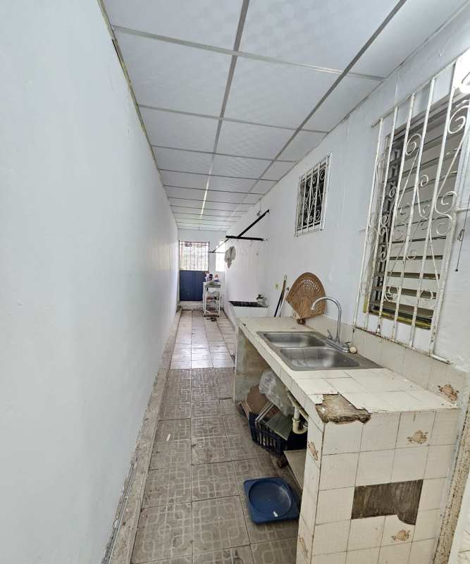 Unfinished interior room with green walls, drop ceiling, and loose tiles Santa Monica Las Mañanitas Panama