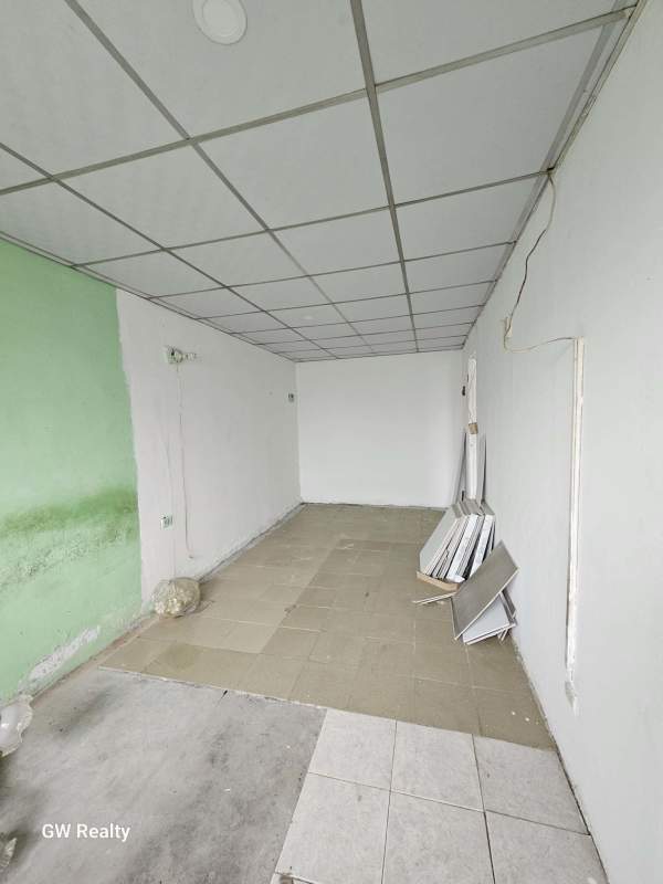 Interior room with unfinished walls drop ceiling business or storage space Santa Monica Panama