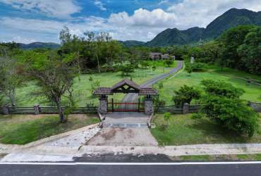 Rustic gourmet kitchen with double ovens, wood cabinetry, granite counters in Valle de Antón Panama estate
