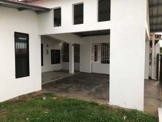 Large open plan living room with door to front patio in Villas del Campo La Chorrera