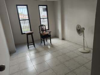 Minimalist tiled area with white walls and doorway at Villas del Campo Panama