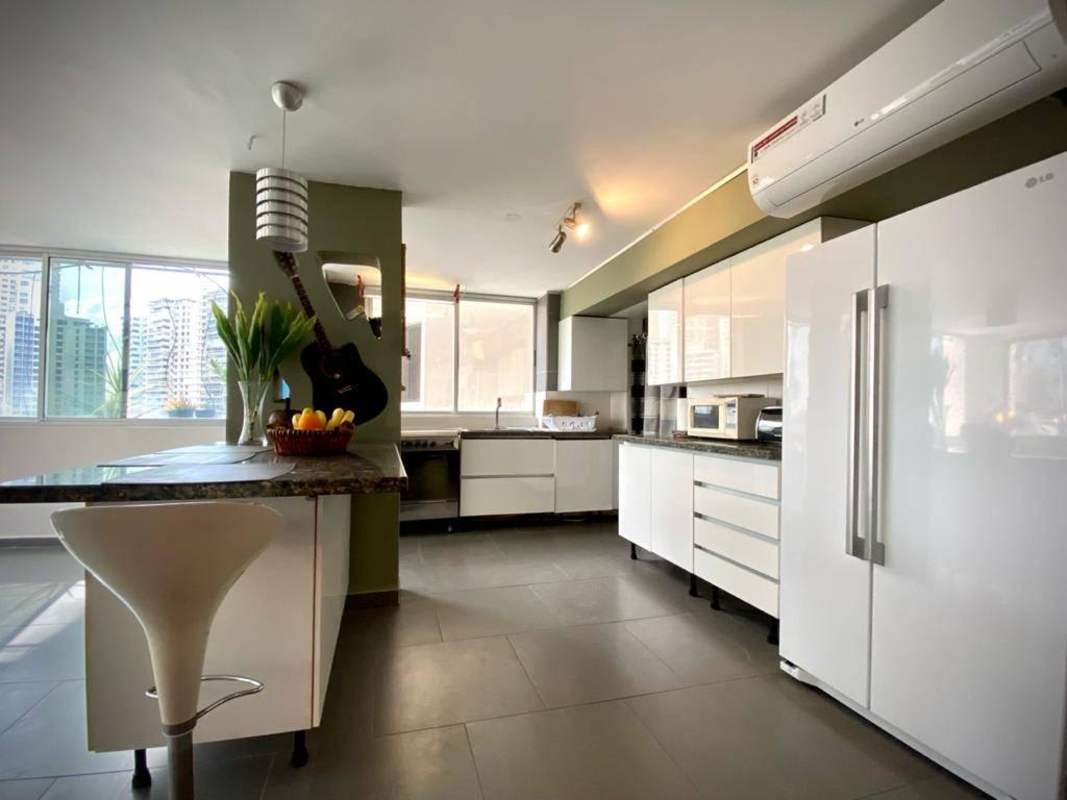 Equipped kitchen with granite counters and appliances in PH Pacific Hills Punta Paitilla Panama