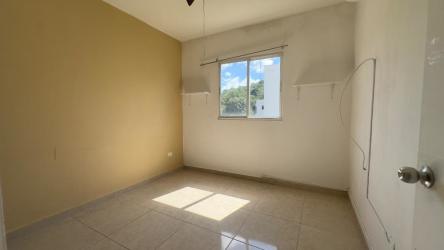 Bright bedroom featuring beige walls, tiled floor, window to garden in Vista Alegre Arraiján Panama