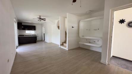 Two-story house interior open kitchen and living room staircase Vista Alegre Arraiján Panama