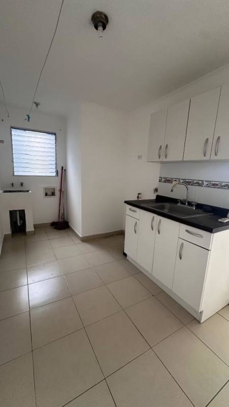 Minimalist kitchen with cabinets and laundry space in PH Río Plaza Río Abajo Panama