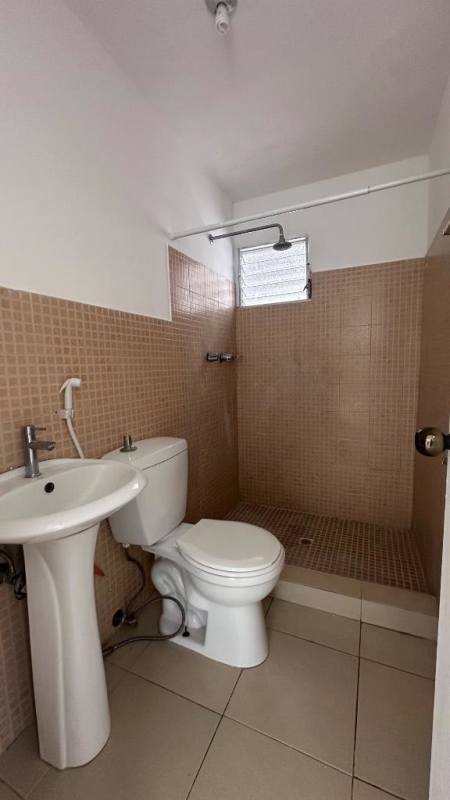 Minimalist tiled bathroom with walk-in shower at PH Río Plaza Panama City