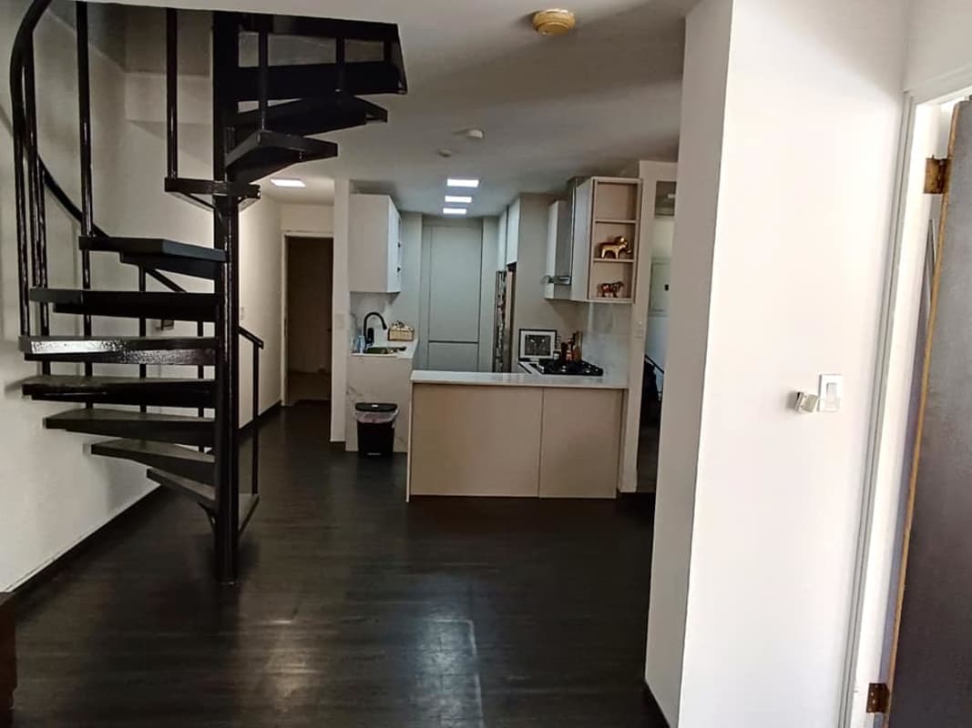 Modern dining area with pendant lighting and dark wood dining table at PH Hato Pintado Tower Panama