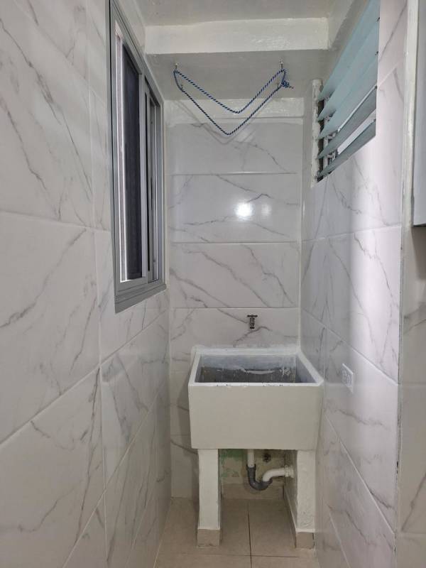 Bright tiled living dining space with ceiling fan in PH Santa María Betania Panama