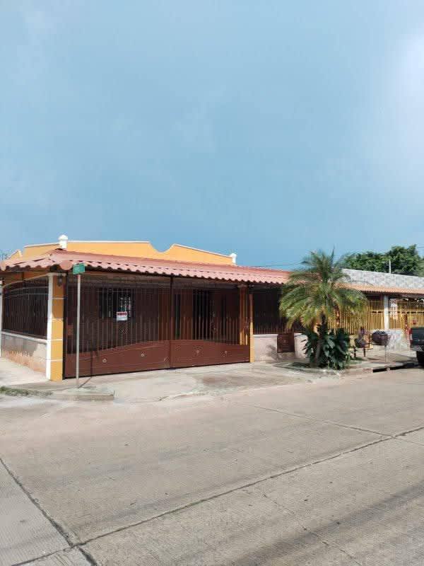 Garage with stone accent wall, tile floor, ceiling fan at Villas de Don Bosco Don Bosco Panama
