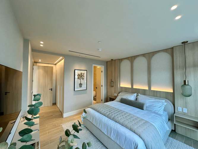 Furnished master bedroom featuring ocean view and balcony access at PH Ocean Club, Panama City