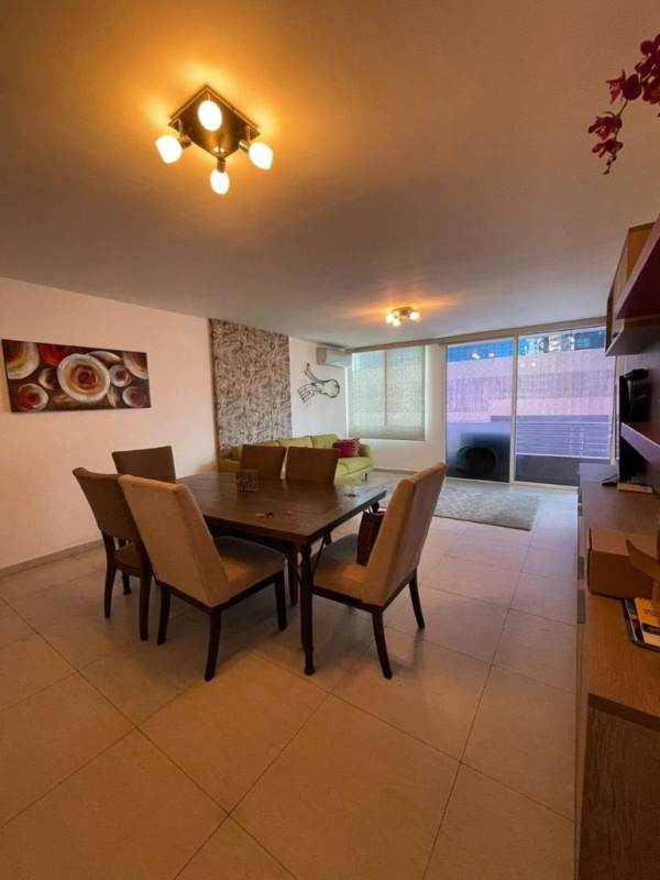 Bright living room and dining area with windows and tile floors in PH Obarrio Palace Obarrio Panama