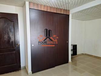 Bedroom featuring sliding closet doors and tiled floor in Antón Panama