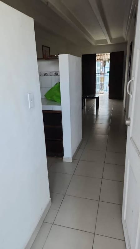 Simple interior hallway leading to metal security door Edificio Z-3 Los Libertadores Panama