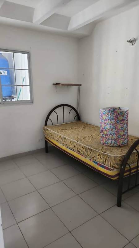 Minimal bedroom featuring security bars on window and tiled floor apartment Edificio Z-3 Panama City
