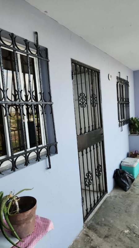 Exterior of Los Libertadores complex with high-rise building, crane, playground and city skyline Panama City