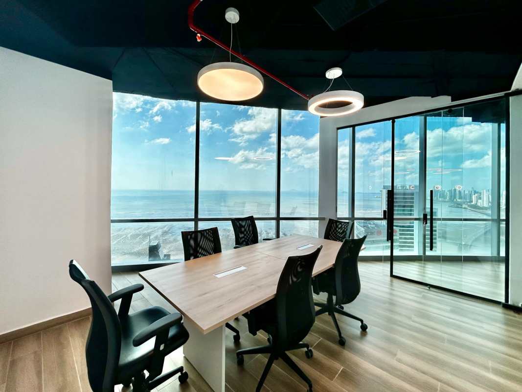 Modern kitchenette with wood and white cabinets in office at BICSA Tower Costa del Este Panama