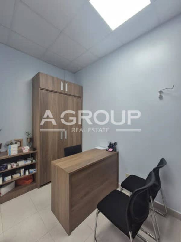 Furnished consultation office with desk chairs cabinets inside Pacifica Salud Hospital Punta Pacífica Panama