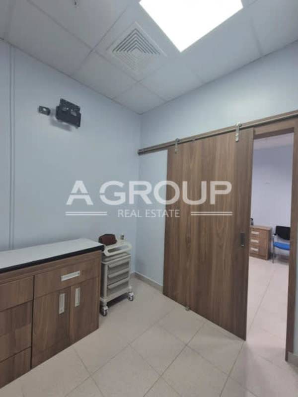 Equipped exam room with medical table cabinets Pacifica Salud Punta Pacífica Panama