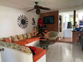 Guest bedroom with sea decor and twin beds in Playa Coronado beach house for sale