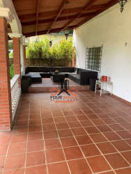 Covered outdoor terrace and patio with seating area at Playa Coronado beach house for sale Panama