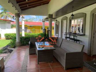 Covered outdoor kitchen with brick BBQ grill at Playa Coronado Panama beach house for sale