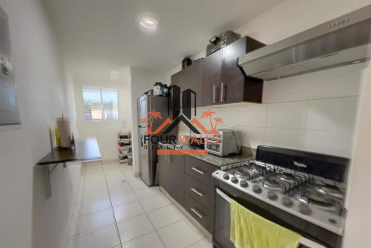 Galley kitchen with granite counters, stainless appliances in PH Villa Lucrecia Panama City
